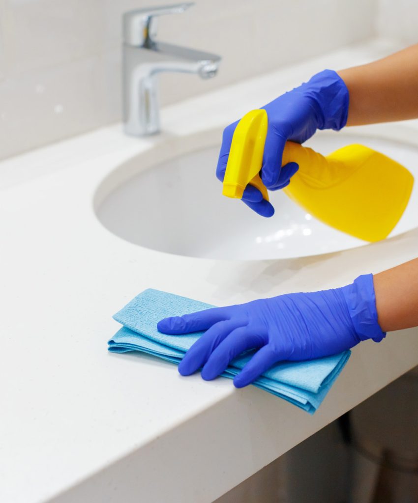Housekeeper cleaning a hotel room